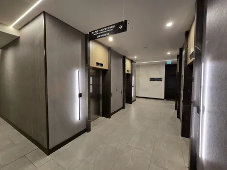 Bright apartment corridor with a modern and simple design.