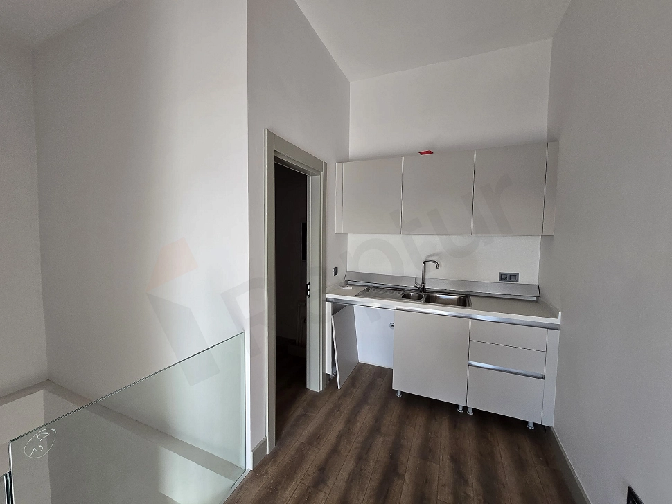 Image of an open plan kitchen.