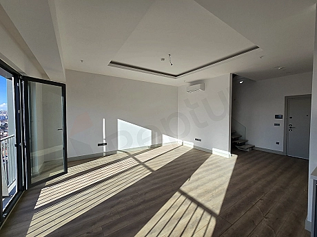 Living room view of a duplex apartment for sale in Ataşehir.