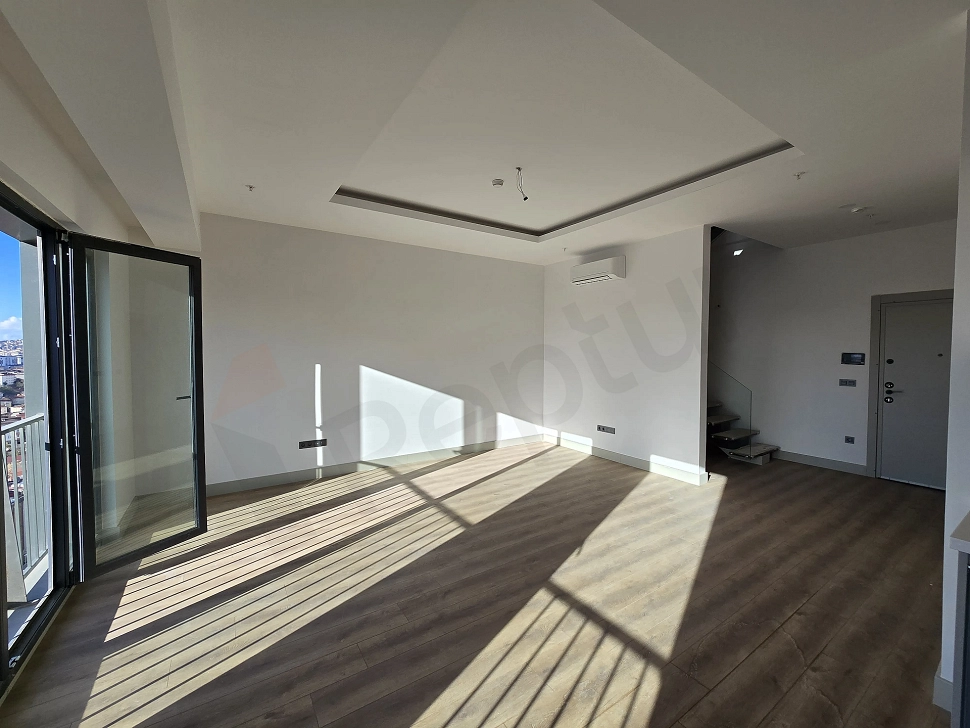 Living room view of a duplex apartment for sale in Ataşehir.