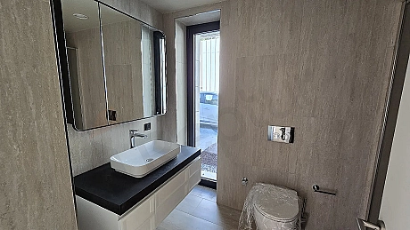 Modern designed, stylish and spacious bathroom area.