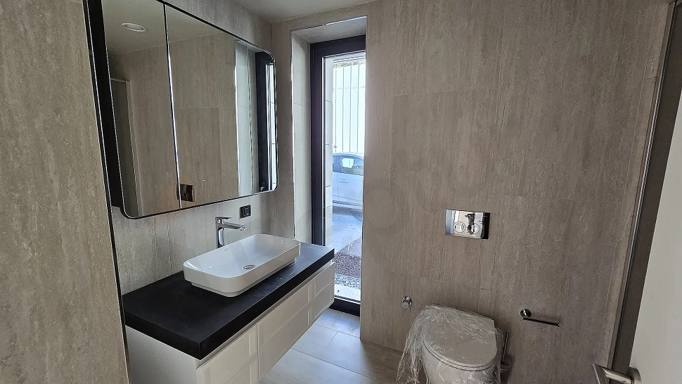 Modern designed, stylish and spacious bathroom area.