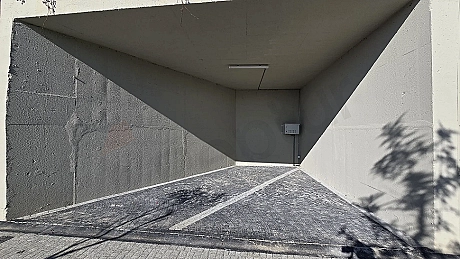 Modern and spacious indoor swimming pool area with sleek design.