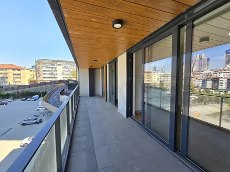 Expansive 2+1 Residence with a Wraparound Balcony and City Views
