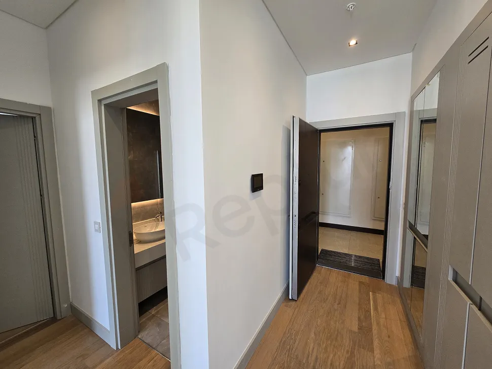 Entrance door and hallway area of a modern residence apartment.