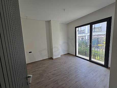 Image of a spacious and bright bedroom.