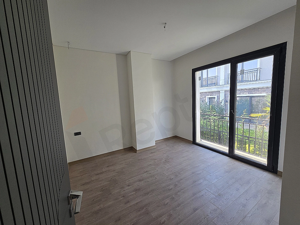 Image of a spacious and bright bedroom.