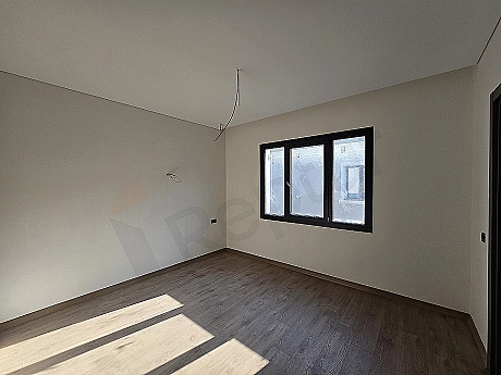 Image of a spacious and bright bedroom.