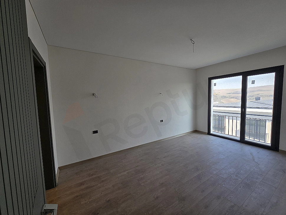 Image of a spacious and bright bedroom.