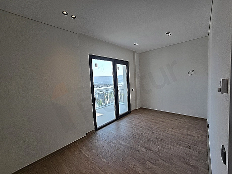 Spacious and bright bedroom.