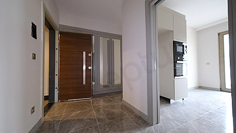 Apartment entrance door and hallway detail.