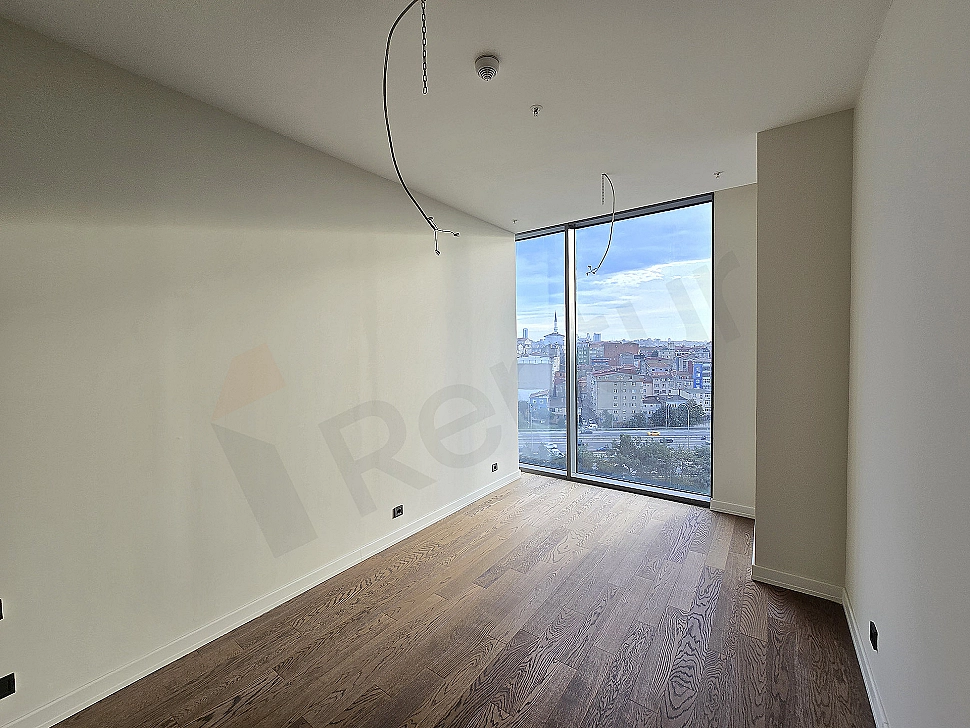 Interior view of a modernly designed bedroom. Details include a double bed, dresser, mirror, and decorative lighting.