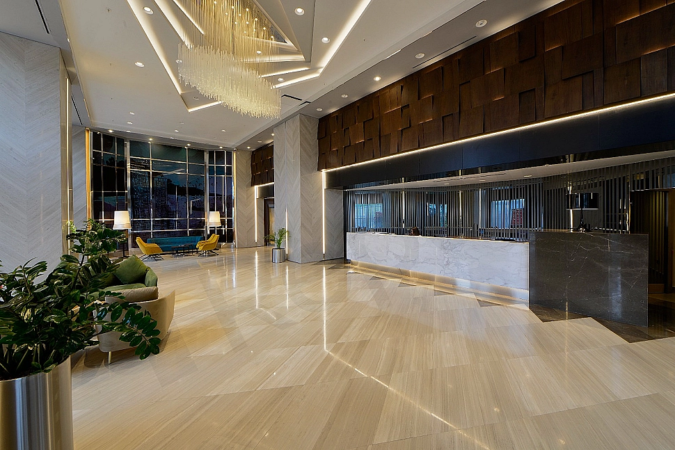 Modern building entrance facade and landscaping.