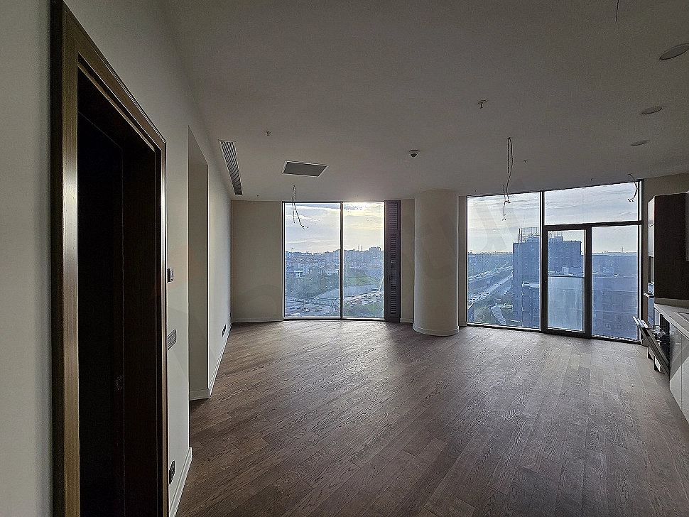 Modern designed living room interior, spacious windows, and minimalist decoration details.