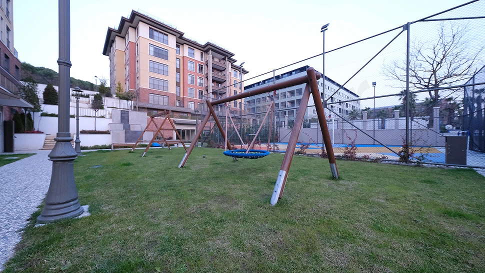 Image of a children's park equipped with colorful playground equipment.
