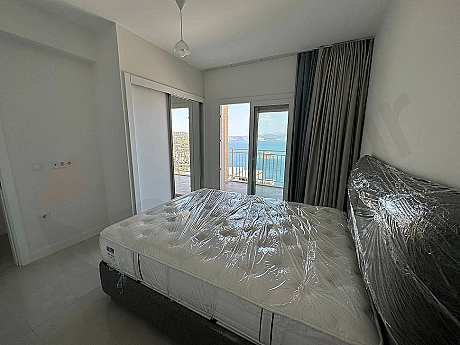 Elegant and spacious bedroom interior decorated with modern furniture.