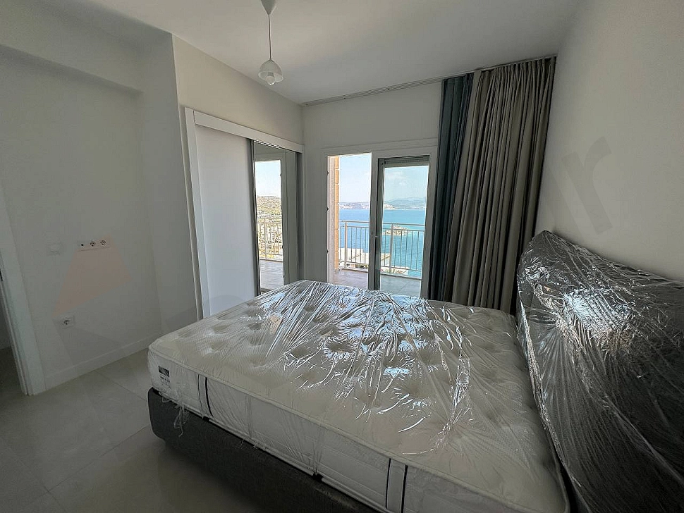 Elegant and spacious bedroom interior decorated with modern furniture.