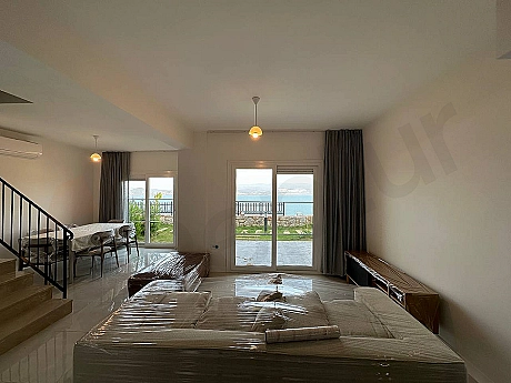 A bright and spacious living room view furnished with modern furniture.