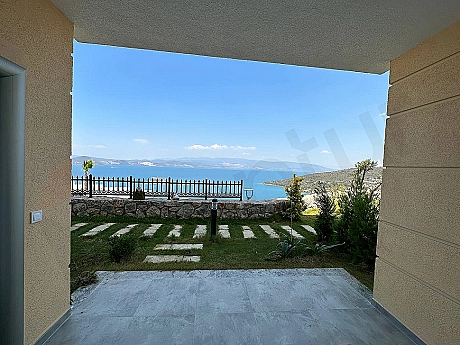 Modern furnished terrace with a wide sea view of a seafront duplex apartment in Bodrum.