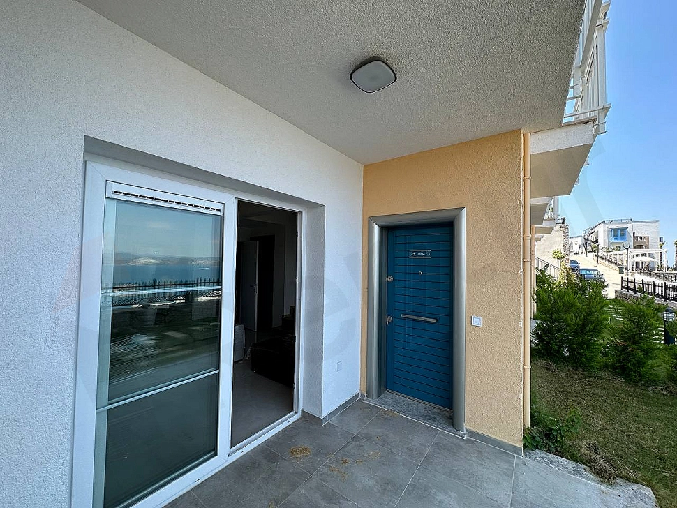 Modern entrance door and hallway of a furnished 2+1 duplex apartment in Bodrum.