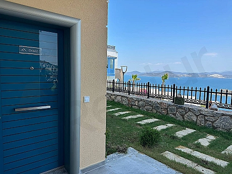 Modern entrance door and hallway of a 2+1 duplex apartment for sale in Bodrum.