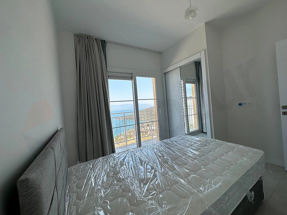 A spacious and bright furnished bedroom decorated with modern furniture.