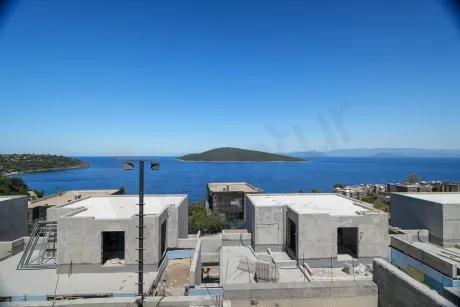 Wide-angle outdoor shot showing a deep blue sea view and coastline in Bodrum.
