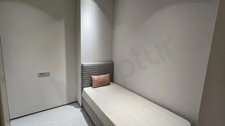 Modern and spaciously designed laundry room area.
