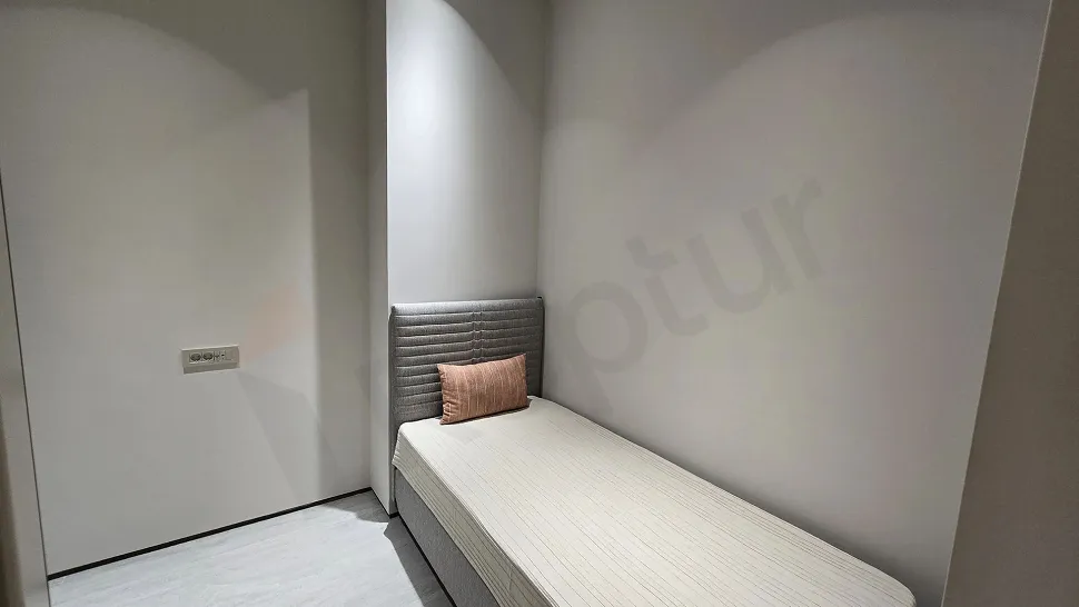 Modern and spaciously designed laundry room area.