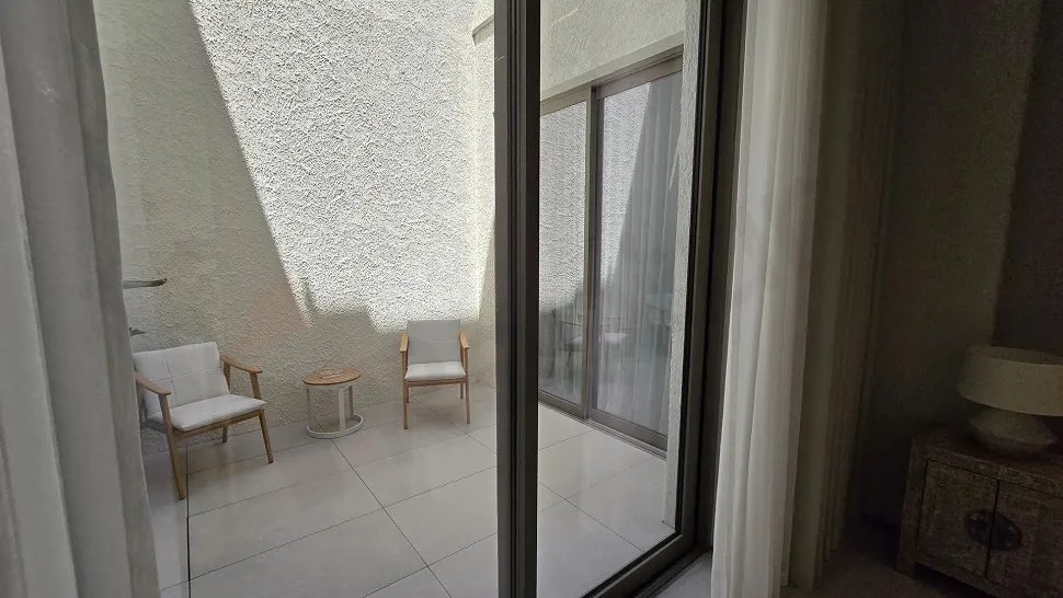 Spacious and modernly designed open terrace area of a detached house with a sea view.