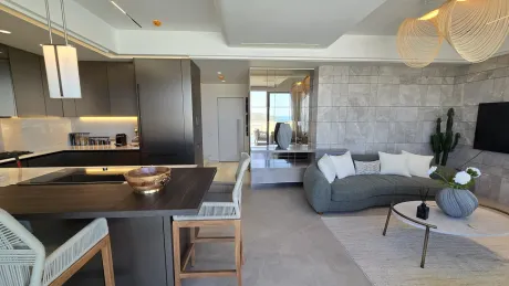 Spacious and bright living room area of a modern villa.