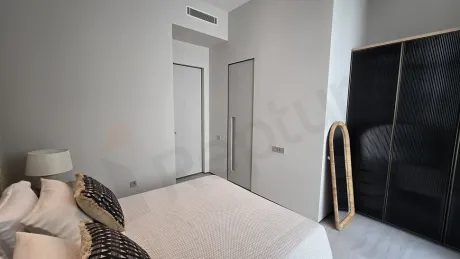 View of a spacious and modern villa bedroom.