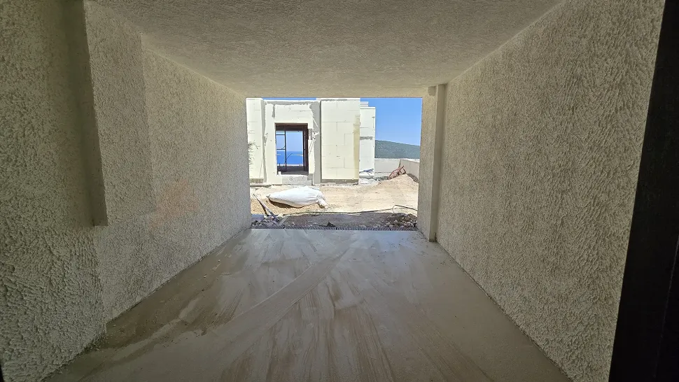 Spacious and secure indoor parking garage area of a modern villa.