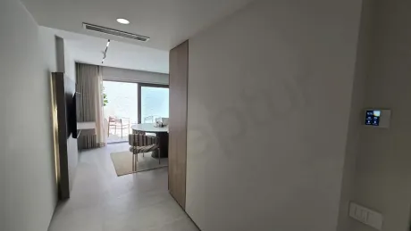 Spacious and bright interior corridor view of a modern villa.