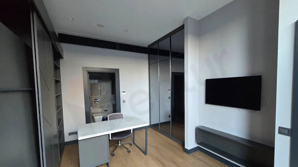 Spacious and brightly lit living room interior decorated with modern furniture.