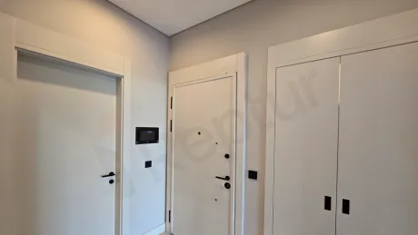 Modern and stylish entrance hallway of a furnished residence apartment with contemporary decor.