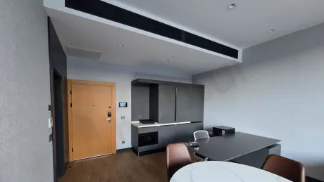 Kitchen area featuring modern design cabinets and countertops.
