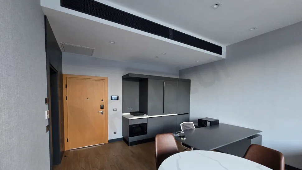Kitchen area featuring modern design cabinets and countertops.