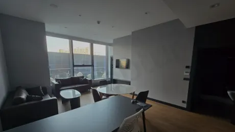 Modern furnished living room interior with stylish decoration and seating area.