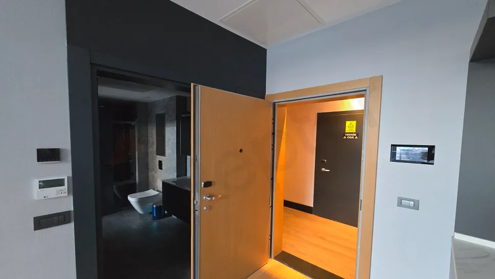 Entrance hall and doorway area of a modern furnished 1+1 apartment.