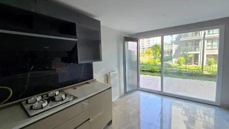 Modern designed, spacious and bright kitchen area.