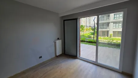 Interior view of a spacious and bright bedroom with a modern design.