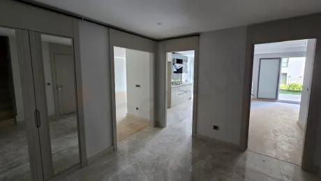 Modern interior staircase design inside a luxury duplex apartment.