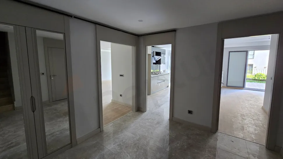 Modern interior staircase design inside a luxury duplex apartment.