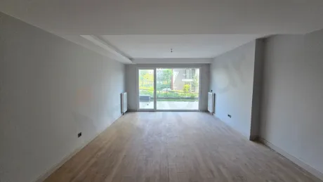Modern living room area with large windows and a city view.