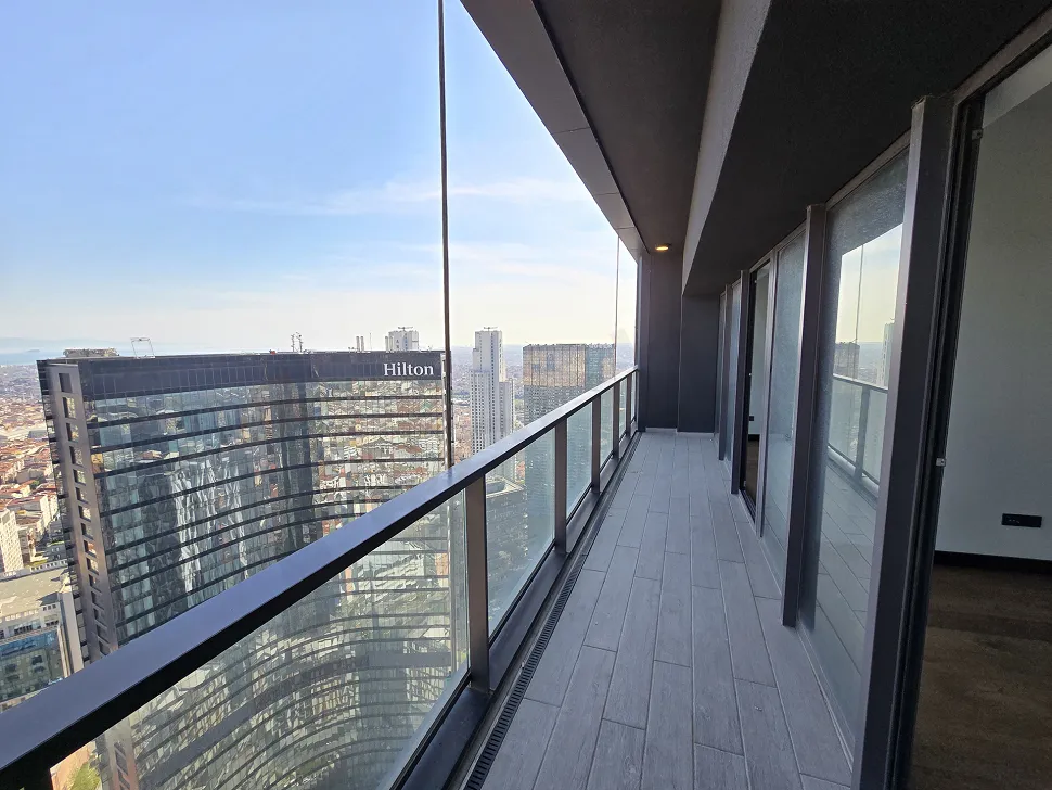 View of a spacious and airy balcony with modern architecture