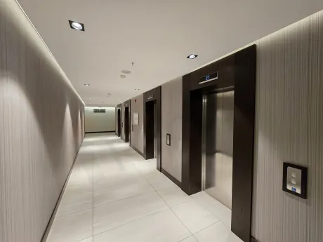Modernly designed, spacious and bright apartment corridor.