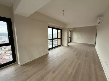 Spacious and bright living room design with large windows.