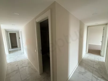 Bright and spacious apartment corridor in a modern building.