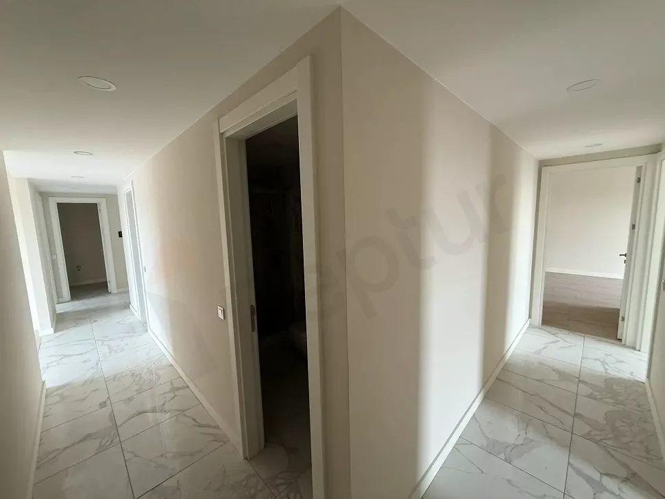 Bright and spacious apartment corridor in a modern building.